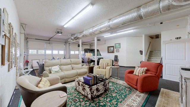 1100 Cypress Rd, Buchanan, TN 38222 - living room featuring a garage and a textured ceiling