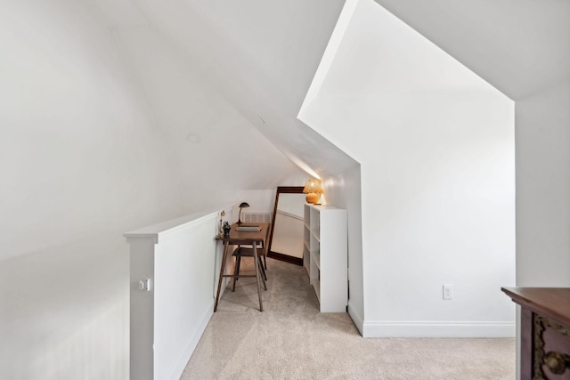 bonus room with vaulted ceiling, carpet floors, and baseboards