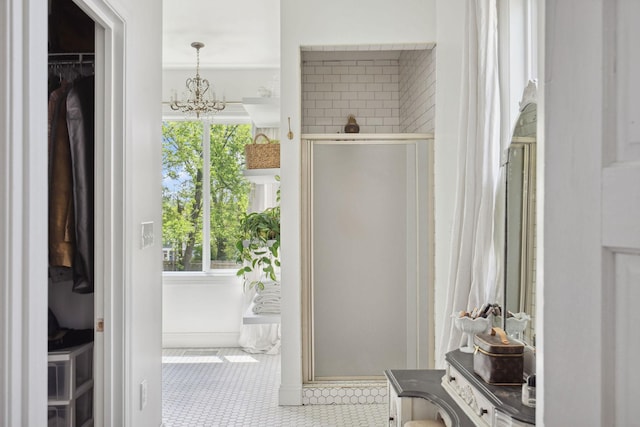 interior space with tile patterned floors and an inviting chandelier