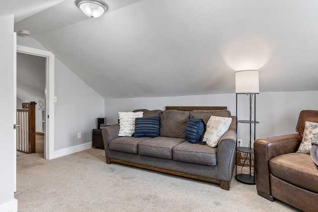 living room with lofted ceiling, baseboards, and carpet floors