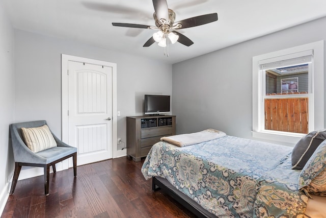 bedroom with dark wood finished floors and ceiling fan