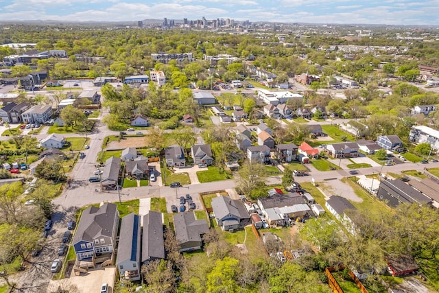 birds eye view of property with a residential view