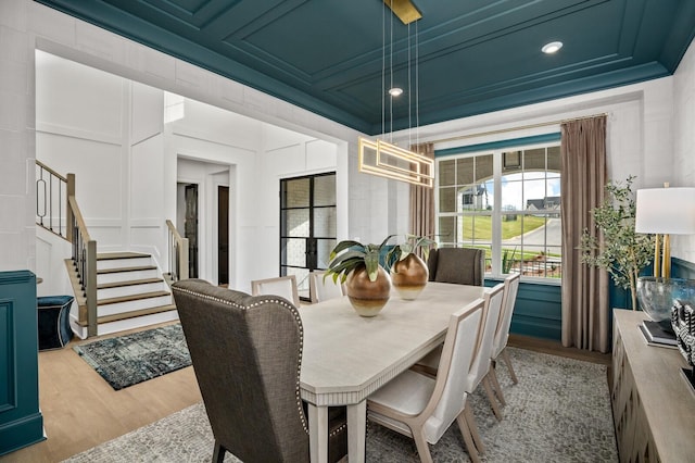 7247 Murrel Dr, Franklin, TN 37064 - dining room with light wood-type flooring, recessed lighting, stairs, and a decorative wall