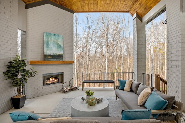 7247 Murrel Dr, Franklin, TN 37064 - exterior space featuring vaulted ceiling, an outdoor brick fireplace, and wooden ceiling