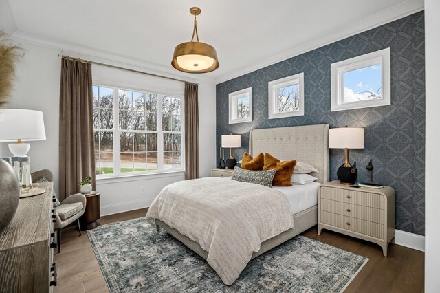 7247 Murrel Dr, Franklin, TN 37064 - bedroom featuring baseboards, an accent wall, wood finished floors, and wallpapered walls