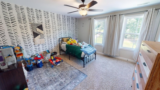 bedroom featuring carpet, visible vents, a ceiling fan, and baseboards