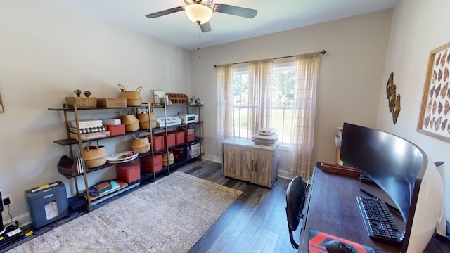 home office with wood finished floors, a ceiling fan, and baseboards