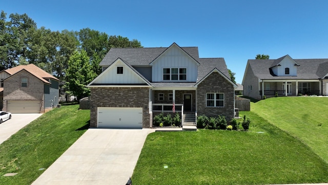 craftsman house with driveway, board and batten siding, an attached garage, a porch, and a front yard
