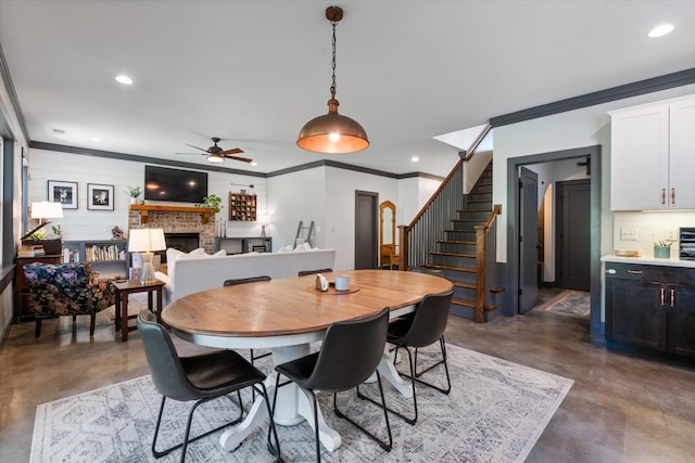 3181 Old Lebanon Dirt Rd, Mount Juliet, TN 37122 - dining space featuring recessed lighting, a fireplace, a ceiling fan, concrete floors, and stairs