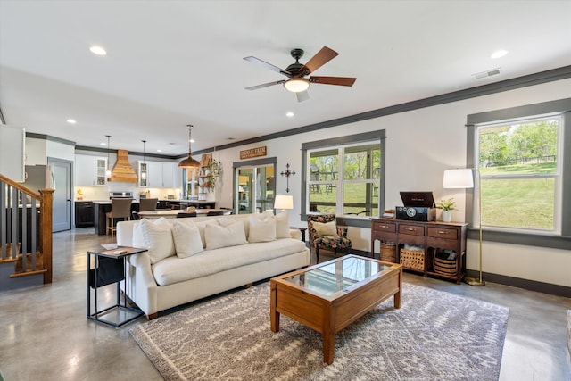 3181 Old Lebanon Dirt Rd, Mount Juliet, TN 37122 - living room with stairway, concrete flooring, ceiling fan, ornamental molding, and visible vents