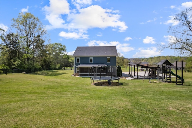 3181 Old Lebanon Dirt Rd, Mount Juliet, TN 37122 - rear view of house featuring a trampoline, a sunroom, a yard, and a playground