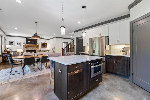 3181 Old Lebanon Dirt Rd, Mount Juliet, TN 37122 - kitchen with white cabinets, concrete flooring, appliances with stainless steel finishes, and recessed lighting