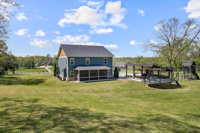 3181 Old Lebanon Dirt Rd, Mount Juliet, TN 37122 - back of property with a sunroom, a yard, and a trampoline