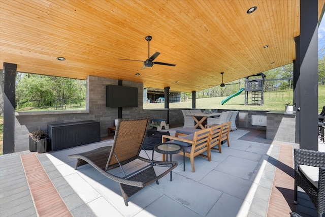3181 Old Lebanon Dirt Rd, Mount Juliet, TN 37122 - view of patio / terrace featuring ceiling fan, an outdoor living space with a fireplace, and a playground