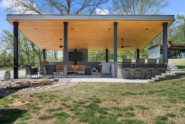 3181 Old Lebanon Dirt Rd, Mount Juliet, TN 37122 - rear view of house with ceiling fan, a lawn, a patio area, and exterior bar