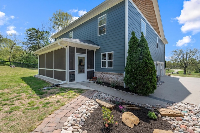3181 Old Lebanon Dirt Rd, Mount Juliet, TN 37122 - back of house featuring an attached garage, a sunroom, fence, and a lawn