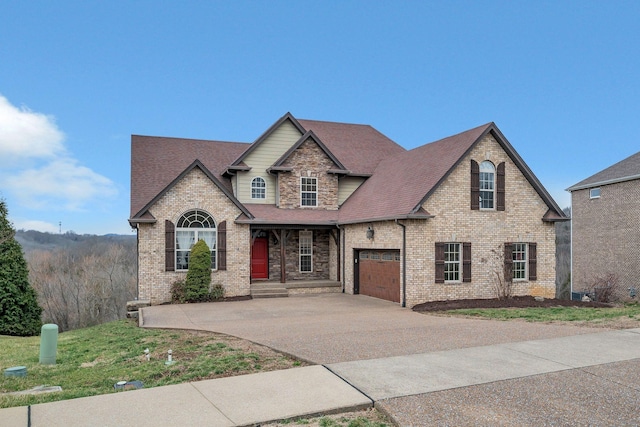 view of front facade with an attached garage, driveway, brick siding, and roof with shingles