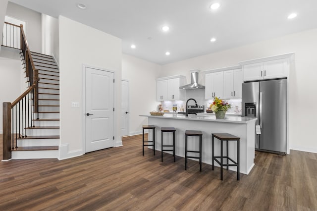 463 Centre St, Pleasant View, TN 37146 - kitchen featuring stainless steel refrigerator with ice dispenser, a center island with sink, dark wood finished floors, and wall chimney range hood