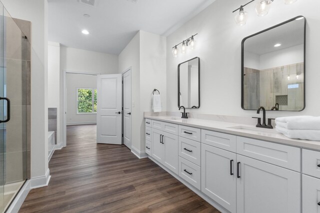 463 Centre St, Pleasant View, TN 37146 - full bathroom featuring wood finished floors, a sink, and a shower stall