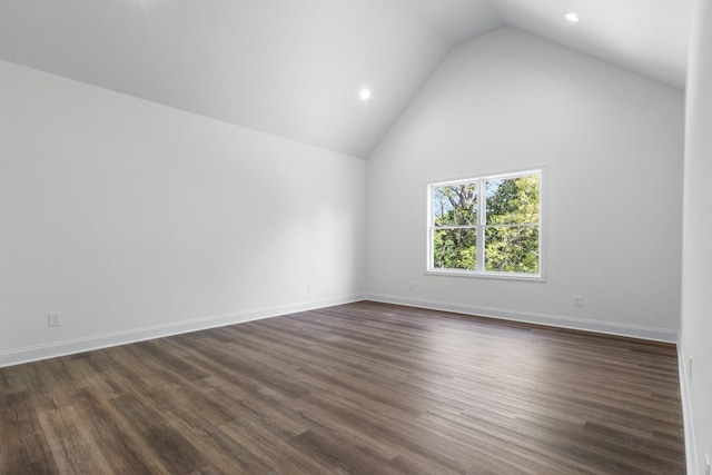 463 Centre St, Pleasant View, TN 37146 - empty room featuring dark wood finished floors, lofted ceiling, baseboards, and recessed lighting