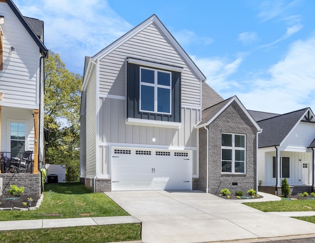 463 Centre St, Pleasant View, TN 37146 - view of front of home with concrete driveway, a front lawn, board and batten siding, a garage, and brick siding