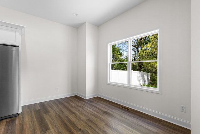 463 Centre St, Pleasant View, TN 37146 - spare room with baseboards, visible vents, and dark wood-style floors