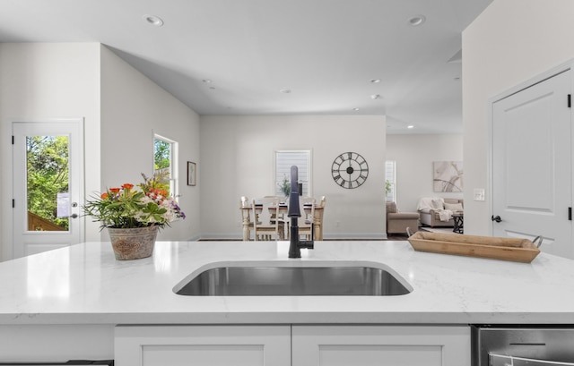 463 Centre St, Pleasant View, TN 37146 - kitchen featuring white cabinets, a sink, open floor plan, recessed lighting, and light stone countertops