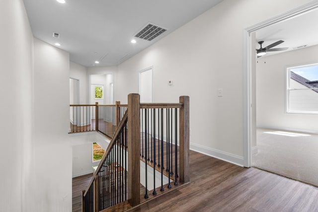 463 Centre St, Pleasant View, TN 37146 - hall featuring wood finished floors, visible vents, an upstairs landing, baseboards, and attic access