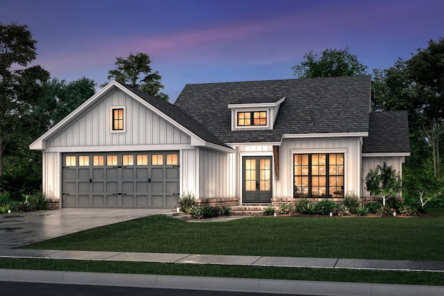 240 Dugout Rd, Summertown, TN 38483 - modern farmhouse with concrete driveway, a lawn, board and batten siding, french doors, and an attached garage