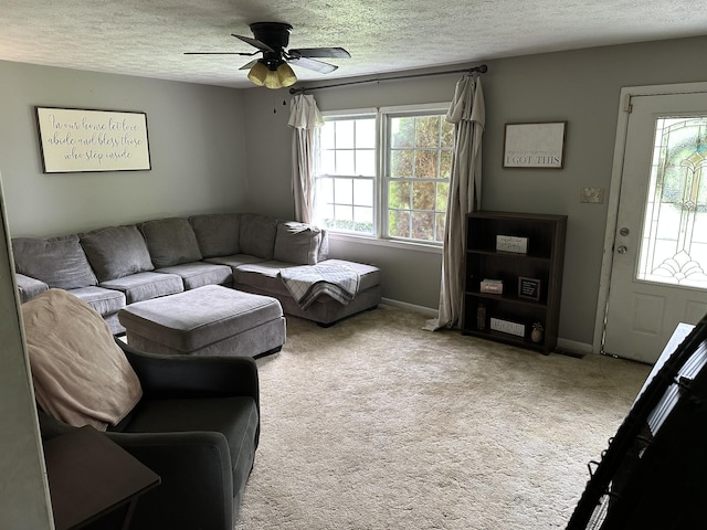 12748 Fruit Hill Red Bridge Rd, Crofton, KY 42217 - carpeted living room with a textured ceiling, ceiling fan, a healthy amount of sunlight, and baseboards