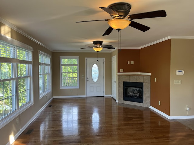 1473 Chapmansboro Rd, Chapmansboro, TN 37035 - foyer featuring baseboards, a tile fireplace, visible vents, and wood finished floors