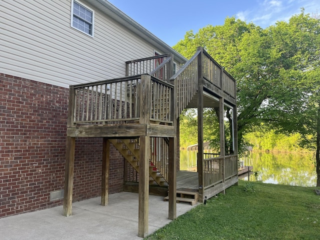 1473 Chapmansboro Rd, Chapmansboro, TN 37035 - wooden deck featuring stairs, a water view, a patio area, and a lawn