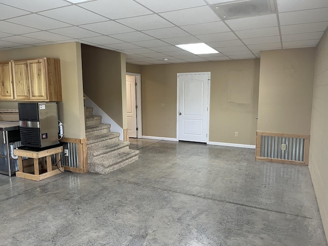 1473 Chapmansboro Rd, Chapmansboro, TN 37035 - unfurnished living room featuring a paneled ceiling, finished concrete floors, baseboards, and stairway