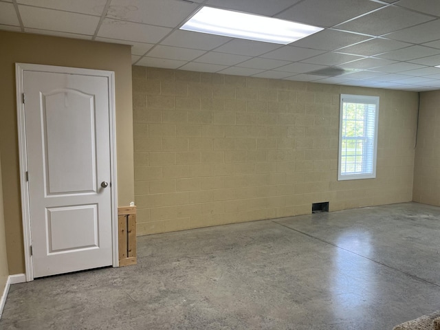 1473 Chapmansboro Rd, Chapmansboro, TN 37035 - basement featuring a paneled ceiling and concrete block wall