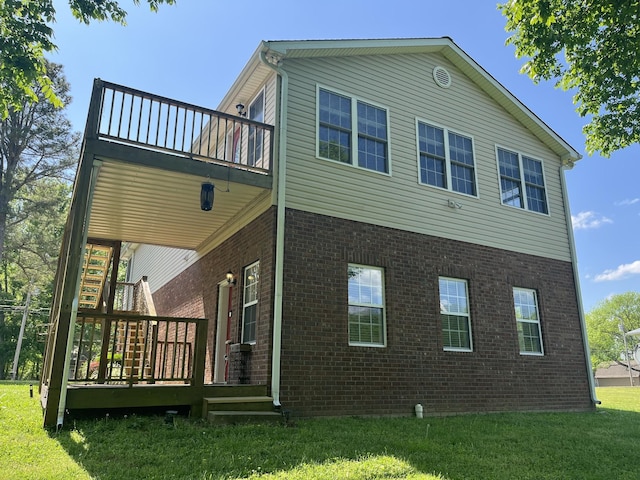 1473 Chapmansboro Rd, Chapmansboro, TN 37035 - back of property with a yard, brick siding, and a deck
