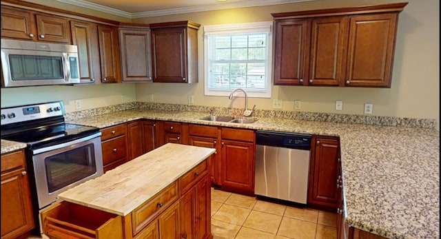 1473 Chapmansboro Rd, Chapmansboro, TN 37035 - kitchen with light tile patterned floors, a sink, crown molding, appliances with stainless steel finishes, and butcher block counters