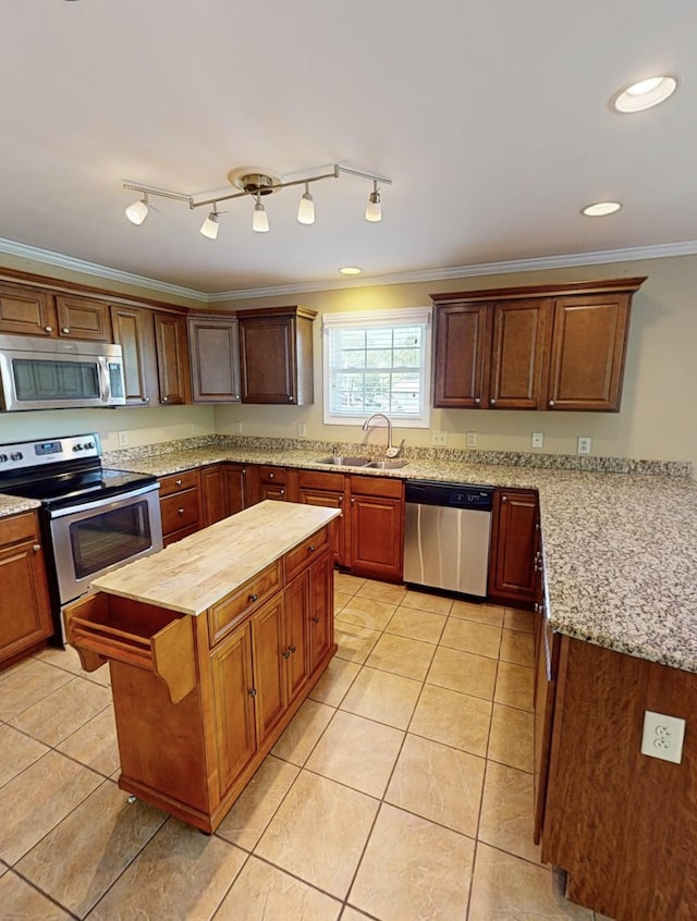 1473 Chapmansboro Rd, Chapmansboro, TN 37035 - kitchen with a sink, ornamental molding, butcher block counters, light tile patterned flooring, and appliances with stainless steel finishes
