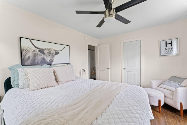 bedroom featuring wood finished floors and ceiling fan