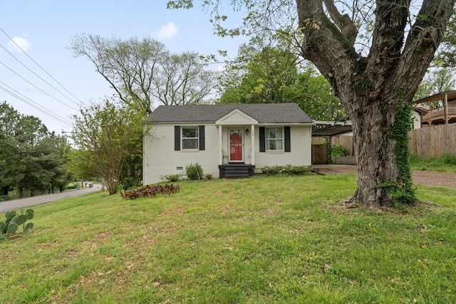 view of front of house featuring a front lawn, fence, a carport, and crawl space