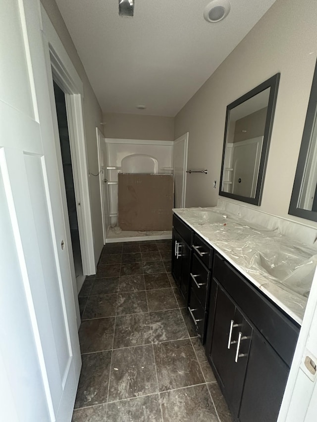 0 Hugh Hunter Rd, Oak Grove, KY 42262 - full bathroom featuring double vanity and stone finish flooring