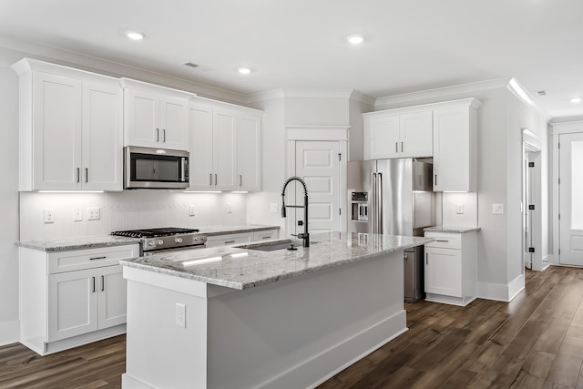 kitchen with crown molding, dark wood-style floors, a sink, and stainless steel appliances