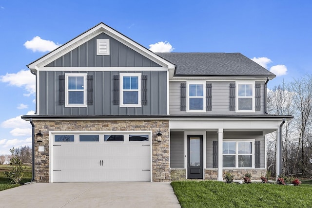 craftsman inspired home with a garage, board and batten siding, a porch, and concrete driveway