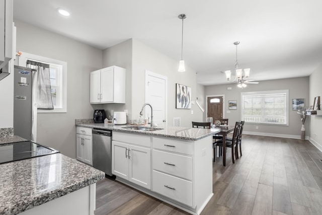 309 Cedar Ct, Clarksville, TN 37042 - kitchen featuring a sink, stainless steel dishwasher, a chandelier, white cabinets, and a peninsula