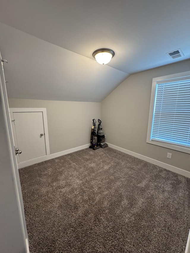 309 Cedar Ct, Clarksville, TN 37042 - additional living space with vaulted ceiling, baseboards, and carpet