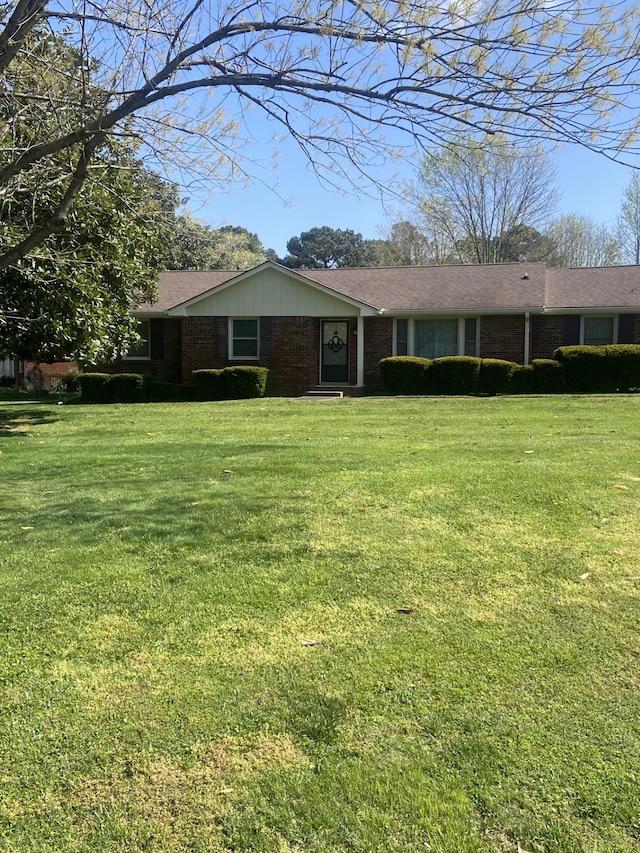 2169 Post Rd, Clarksville, TN 37043 - ranch-style home with a front yard and brick siding