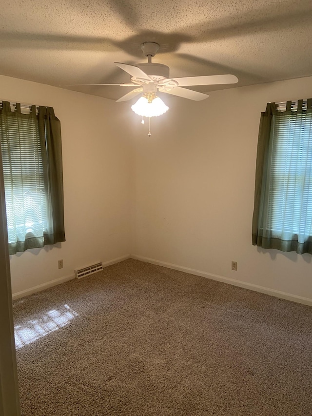 2169 Post Rd, Clarksville, TN 37043 - carpeted spare room featuring visible vents, a ceiling fan, a textured ceiling, and baseboards