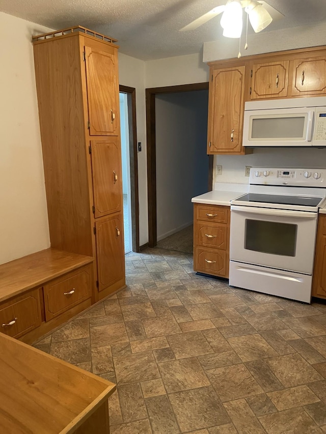 2169 Post Rd, Clarksville, TN 37043 - kitchen with light countertops, ceiling fan, white appliances, and a textured ceiling
