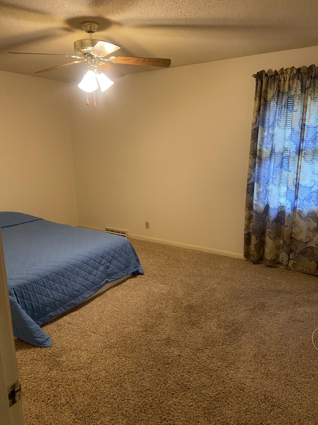 2169 Post Rd, Clarksville, TN 37043 - carpeted bedroom with a ceiling fan, a textured ceiling, and visible vents