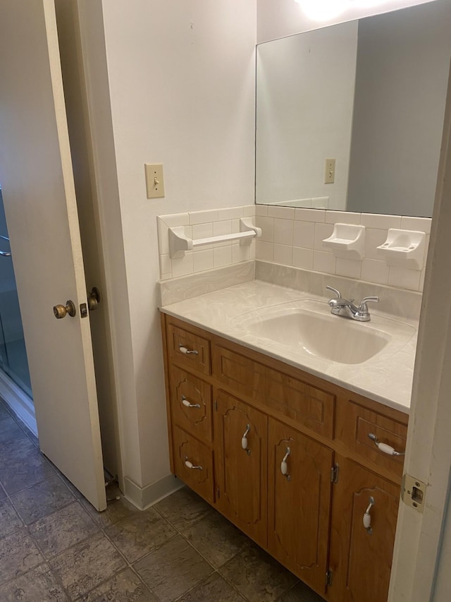 2169 Post Rd, Clarksville, TN 37043 - bathroom featuring vanity, baseboards, and decorative backsplash