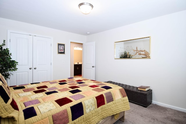 bedroom featuring baseboards, carpet flooring, and a closet